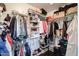 Spacious walk-in closet with abundant shelving, hanging rods, and organized storage solutions at 238 W Marco Polo Rd, Phoenix, AZ 85027