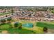 A beautiful aerial view of a community golf course with scenic landscaping, and blue skies at 2461 Leisure World --, Mesa, AZ 85206