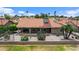 Aerial view of the backyard featuring desert landscaping and a covered patio at 2461 Leisure World --, Mesa, AZ 85206