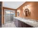 Modern bathroom with double sinks, granite countertops, and updated fixtures at 2461 Leisure World --, Mesa, AZ 85206
