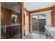Elegant bathroom with a glass-enclosed shower and vanity with granite counters at 2461 Leisure World --, Mesa, AZ 85206