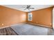 Well-lit bedroom featuring carpet, a ceiling fan, and a bright window at 2461 Leisure World --, Mesa, AZ 85206