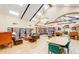 A well stocked library with comfortable seating, tables and chairs, and decorative lighting at 2461 Leisure World --, Mesa, AZ 85206