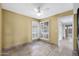 Bright dining room with tile floors and a view to the backyard through the windows at 2461 Leisure World --, Mesa, AZ 85206