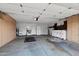 Spacious two-car garage with abundant cabinet storage and functional workspace area at 2461 Leisure World --, Mesa, AZ 85206
