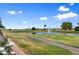 Scenic view of a well-maintained golf course with a tranquil pond at 2461 Leisure World --, Mesa, AZ 85206