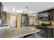 Modern kitchen featuring stone countertops, stainless steel appliances, and ample cabinet space at 2461 Leisure World --, Mesa, AZ 85206