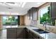 Beautiful kitchen with a granite countertop, ample storage space, and natural light from the window at 2461 Leisure World --, Mesa, AZ 85206