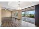 Bright living room with tile and wood floors and a view of the patio and backyard at 2461 Leisure World --, Mesa, AZ 85206