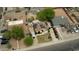 Aerial view of a house with solar panels and surrounding properties in a neighborhood at 2542 W Missouri Ave, Phoenix, AZ 85017