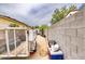 A fenced-in backyard area featuring a trailer and stacked containers at 2542 W Missouri Ave, Phoenix, AZ 85017