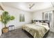 Bright bedroom with neutral walls, ceiling fan, gray rug and large windows for great natural light at 2542 W Missouri Ave, Phoenix, AZ 85017