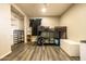 A bedroom with light wood flooring and a bunk bed, providing a cozy space at 2542 W Missouri Ave, Phoenix, AZ 85017