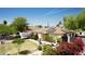 Single-Gathering home featuring a well-manicured lawn and solar panels at 2542 W Missouri Ave, Phoenix, AZ 85017