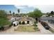 Charming single-Gathering home featuring a well-manicured lawn and solar panels at 2542 W Missouri Ave, Phoenix, AZ 85017