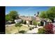 Charming single-Gathering home featuring a well-manicured lawn, flowerbeds, and solar panels at 2542 W Missouri Ave, Phoenix, AZ 85017