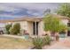 Home with desert landscaping, solar panels, and a charming front porch, ready for your personal touch at 2542 W Missouri Ave, Phoenix, AZ 85017