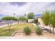 Well-kept lawn with xeriscaping and mature landscaping in front of charming single-story house at 2542 W Missouri Ave, Phoenix, AZ 85017