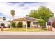 Charming home featuring solar panels, a well-maintained lawn, and desert landscaping at 2542 W Missouri Ave, Phoenix, AZ 85017