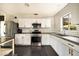 Updated kitchen with granite countertops, stainless steel appliances, and white subway tile backsplash at 2542 W Missouri Ave, Phoenix, AZ 85017