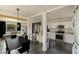Modern kitchen features white cabinets, stainless steel appliances, granite countertops, and an open layout at 2542 W Missouri Ave, Phoenix, AZ 85017