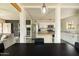 Bright kitchen leads to living area, featuring white cabinets and subway tile backsplash at 2542 W Missouri Ave, Phoenix, AZ 85017
