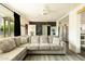 Comfortable living room with lots of natural light, gray sofa and easy access to kitchen at 2542 W Missouri Ave, Phoenix, AZ 85017