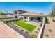 Aerial view of the backyard with artificial grass, paved patio, and outdoor seating area at 2885 N 164Th Dr, Goodyear, AZ 85395