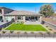 Aerial view of backyard with artificial grass, paved patio, and covered seating at 2885 N 164Th Dr, Goodyear, AZ 85395