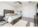 Bright bedroom features a king-sized bed and modern furnishings and decor at 2885 N 164Th Dr, Goodyear, AZ 85395