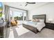 Bright bedroom with a large window, comfortable seating and an inviting king-sized bed at 2885 N 164Th Dr, Goodyear, AZ 85395