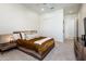 Cozy bedroom with queen-sized bed, ceiling fan, and a closet at 2885 N 164Th Dr, Goodyear, AZ 85395