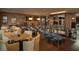Elegant dining area with a brick wall and decorative light fixtures at 2885 N 164Th Dr, Goodyear, AZ 85395