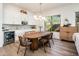 Cozy dining area with stylish lighting, a modern table, and convenient access to the kitchen and living spaces at 2885 N 164Th Dr, Goodyear, AZ 85395