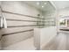 Shower featuring modern tile work and a frameless glass enclosure at 2885 N 164Th Dr, Goodyear, AZ 85395