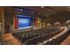 Beautiful community theater with red curtains, a stage and rows of comfortable seating at 2885 N 164Th Dr, Goodyear, AZ 85395
