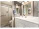 Updated bathroom featuring a new vanity, brushed nickel hardware and step-in shower at 3215 W Phelps Rd, Phoenix, AZ 85053