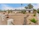 Charming single-story home featuring drought-resistant landscaping and a quaint wooden fence in a well-maintained front yard at 3215 W Phelps Rd, Phoenix, AZ 85053
