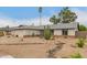 Charming home featuring desert landscaping and a well-maintained front yard at 3215 W Phelps Rd, Phoenix, AZ 85053