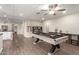 Large game room with a pool table, media center, and access to other areas of the home at 3215 W Phelps Rd, Phoenix, AZ 85053