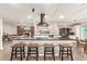 Expansive kitchen with a large island, breakfast bar seating, modern appliances, and seamless transition to living spaces at 3215 W Phelps Rd, Phoenix, AZ 85053