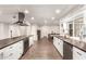 Bright kitchen showcasing white cabinetry, dark wood counters, and stainless steel appliances at 3215 W Phelps Rd, Phoenix, AZ 85053