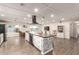 Spacious kitchen featuring a large island, modern appliances, and an open floor plan at 3215 W Phelps Rd, Phoenix, AZ 85053