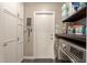 Well-equipped laundry room featuring modern washer/dryer, storage cabinets and folding space at 3215 W Phelps Rd, Phoenix, AZ 85053