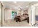 Main bedroom featuring a ceiling fan, slider to yard, and ensuite bathroom at 3215 W Phelps Rd, Phoenix, AZ 85053