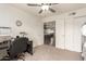 Well-lit office featuring large closet and views into the dining and kitchen area at 3215 W Phelps Rd, Phoenix, AZ 85053