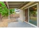Covered patio area with neutral tones, a dining set and a sliding door to indoor living at 3215 W Phelps Rd, Phoenix, AZ 85053