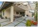 Covered patio with large pergola, dining area, seating and views of the backyard at 3215 W Phelps Rd, Phoenix, AZ 85053