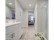 Bathroom with double sinks, shower, and access to the bedroom at 33974 N Beeblossom Trl, San Tan Valley, AZ 85144