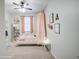Colorful and whimsical bedroom featuring a twin bed with canopy and flamingo decor at 33974 N Beeblossom Trl, San Tan Valley, AZ 85144